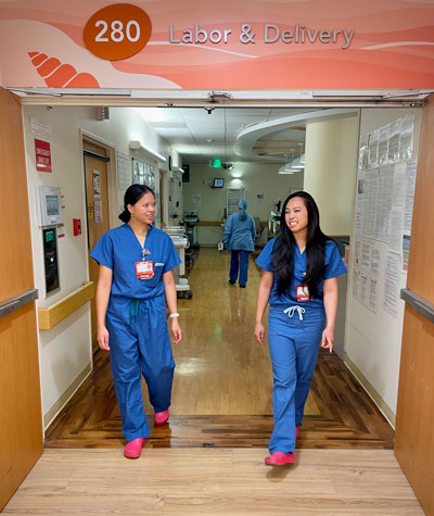 The Darmawan sisters walk down the hall at Lucile Packard Children's Hospital Stanford