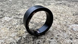 Smart Ultrahuman Ring Air on concrete.